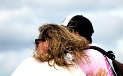 a couple of people that are hugging each other