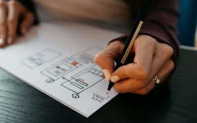 person writing on white paper