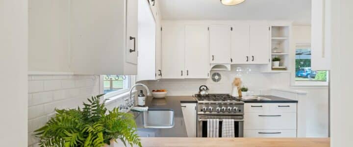 white wooden kitchen cupboards and gray gas stove