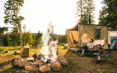 woman sitting on chair near tent