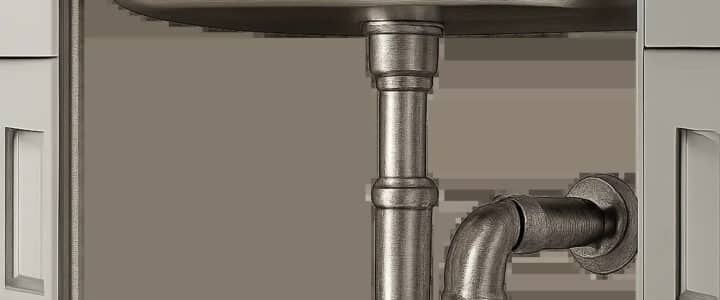 Illustration d’un siphon d’évier moderne sous un évier de cuisine, mettant en avant la propreté et la fiabilité. L’image suggère une solution durable contre les bouchons et les mauvaises odeurs.
